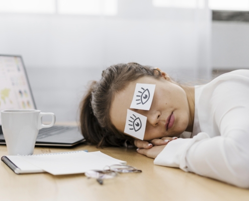 image by freepik.com - tired-businesswoman-covering-her-eyes-with-drawn-eyes-paper
